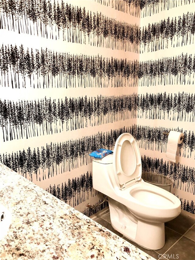 bathroom featuring tile patterned floors and toilet