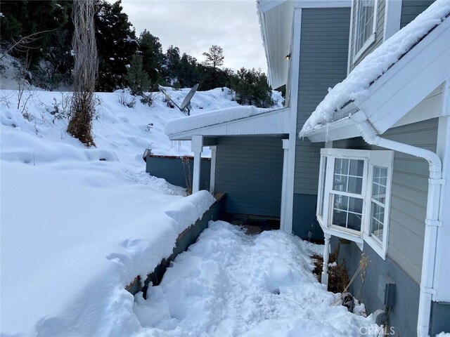 view of snow covered property