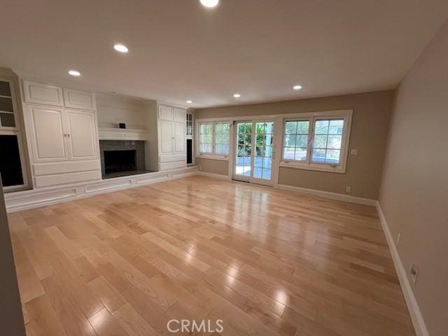 unfurnished living room featuring light hardwood / wood-style floors