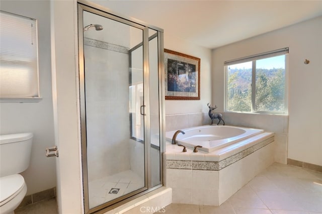 bathroom featuring separate shower and tub, toilet, and tile patterned flooring