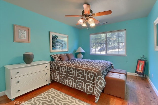 bedroom featuring wood-type flooring and ceiling fan