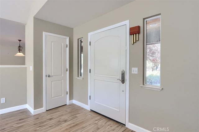 foyer with light wood-type flooring