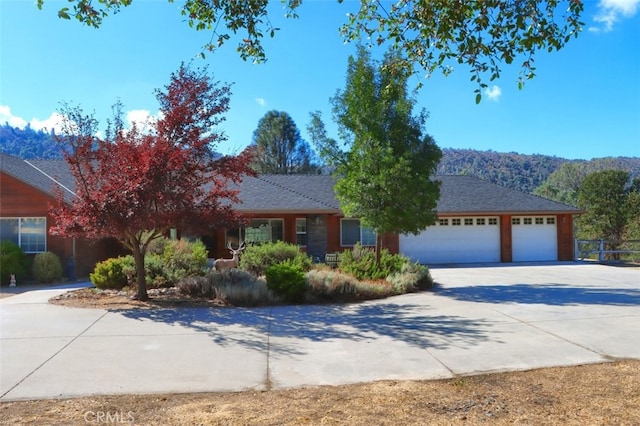 ranch-style house featuring a garage