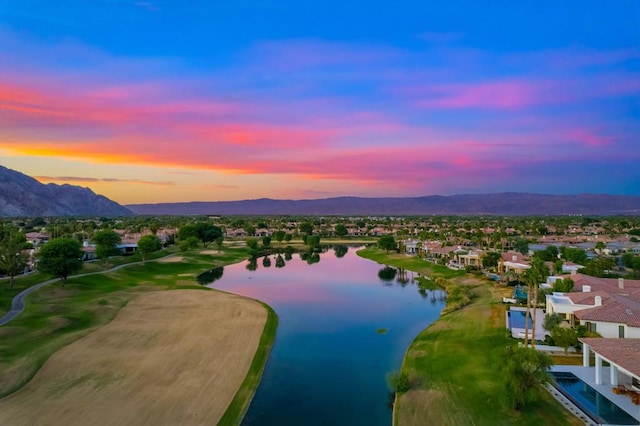 aerial view at dusk with a water and mountain view