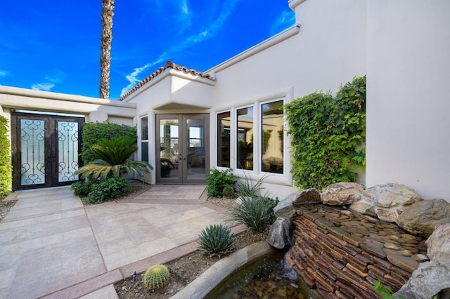 view of patio featuring french doors