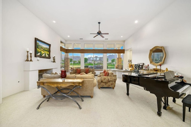 living room featuring carpet and ceiling fan