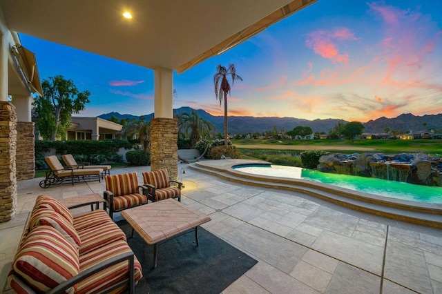 patio terrace at dusk with a mountain view