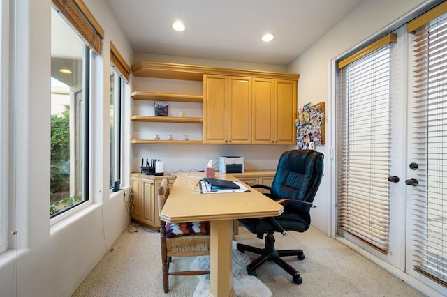 office area featuring light carpet