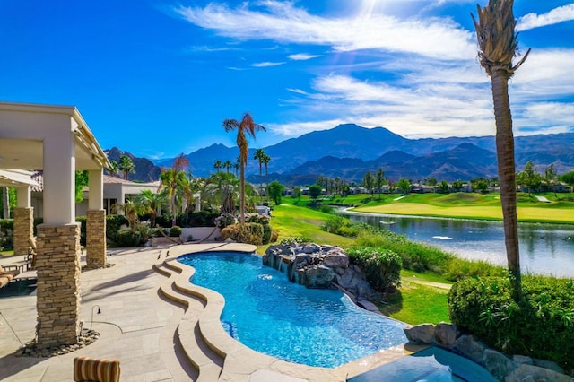 view of swimming pool featuring a water and mountain view