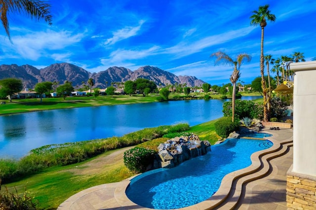 view of pool with a water and mountain view