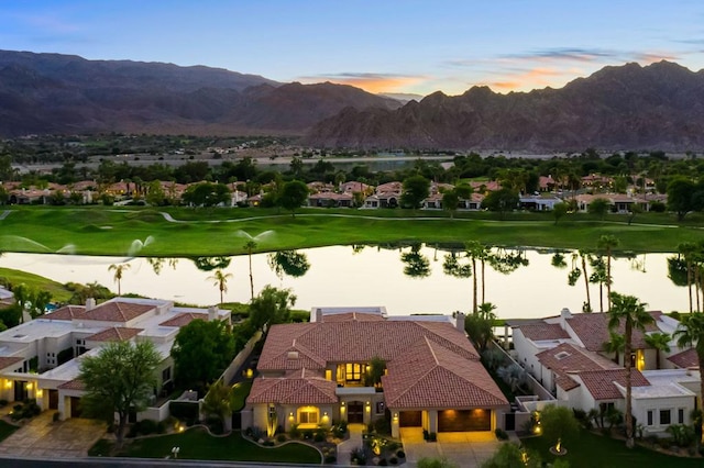 exterior space featuring a water and mountain view