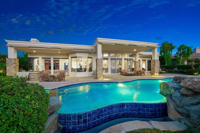 view of swimming pool with a patio area