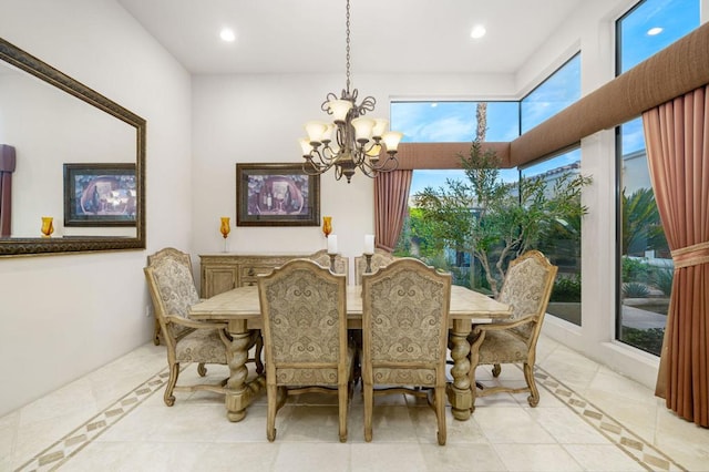 dining area featuring a notable chandelier and light tile patterned floors