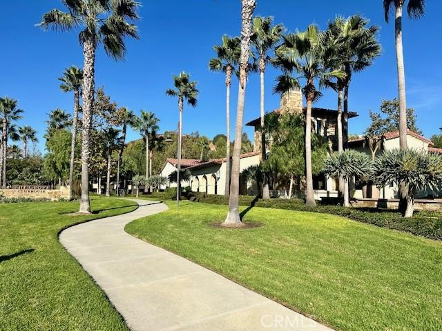 view of property's community with a lawn