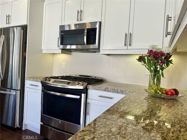 kitchen with white cabinets and stainless steel appliances