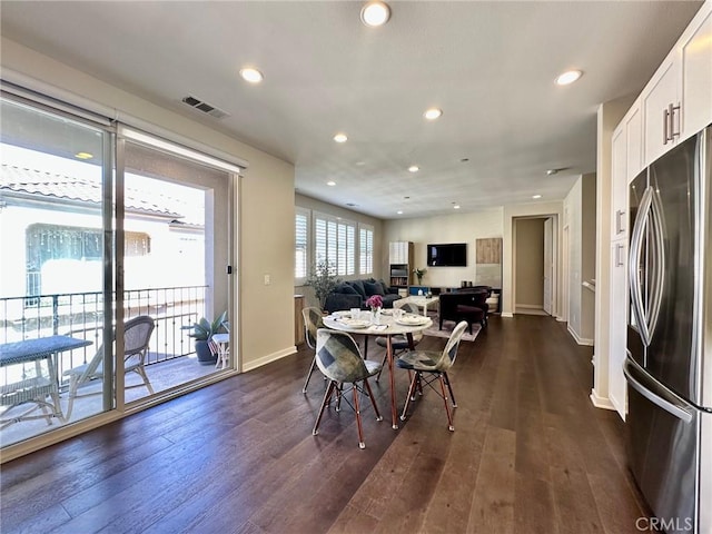 dining room with dark wood-type flooring