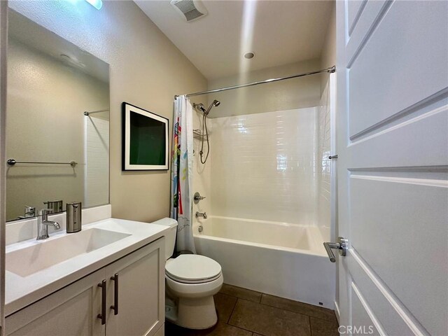 full bathroom featuring toilet, shower / tub combo, tile patterned floors, and vanity