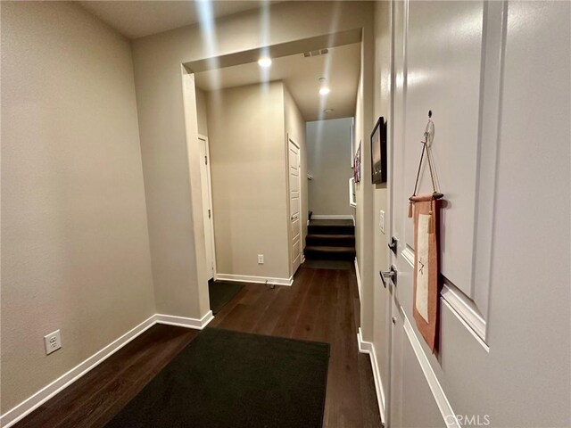 hallway featuring dark hardwood / wood-style flooring