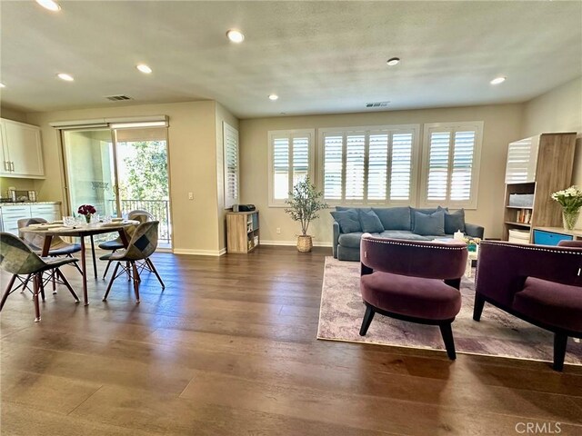 living room featuring dark wood-type flooring