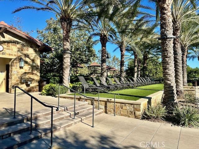 surrounding community featuring a lawn and a patio