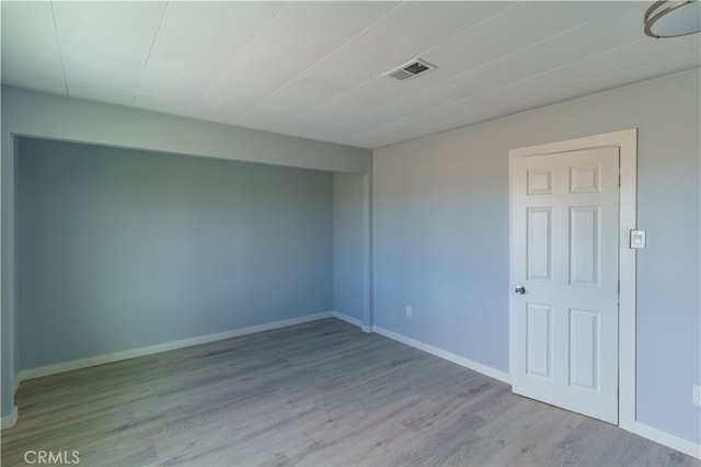 empty room with light wood-type flooring