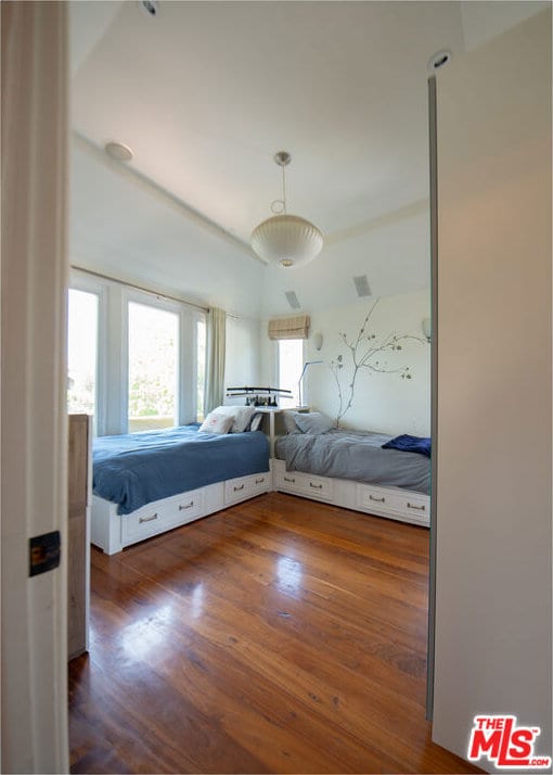 unfurnished bedroom featuring dark hardwood / wood-style flooring