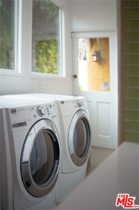 washroom with independent washer and dryer