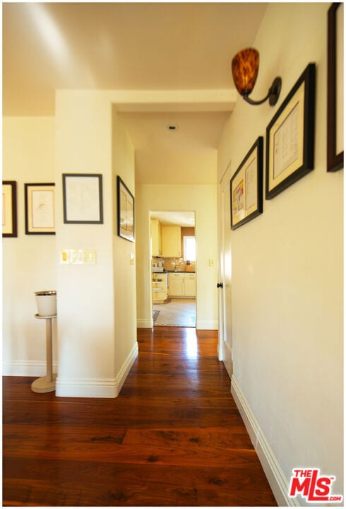 hall featuring dark wood-type flooring