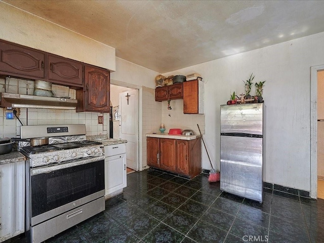 kitchen with backsplash, stainless steel appliances, and custom range hood