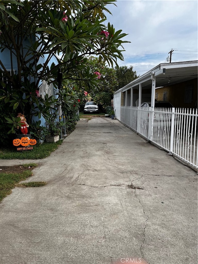 view of side of home with a carport