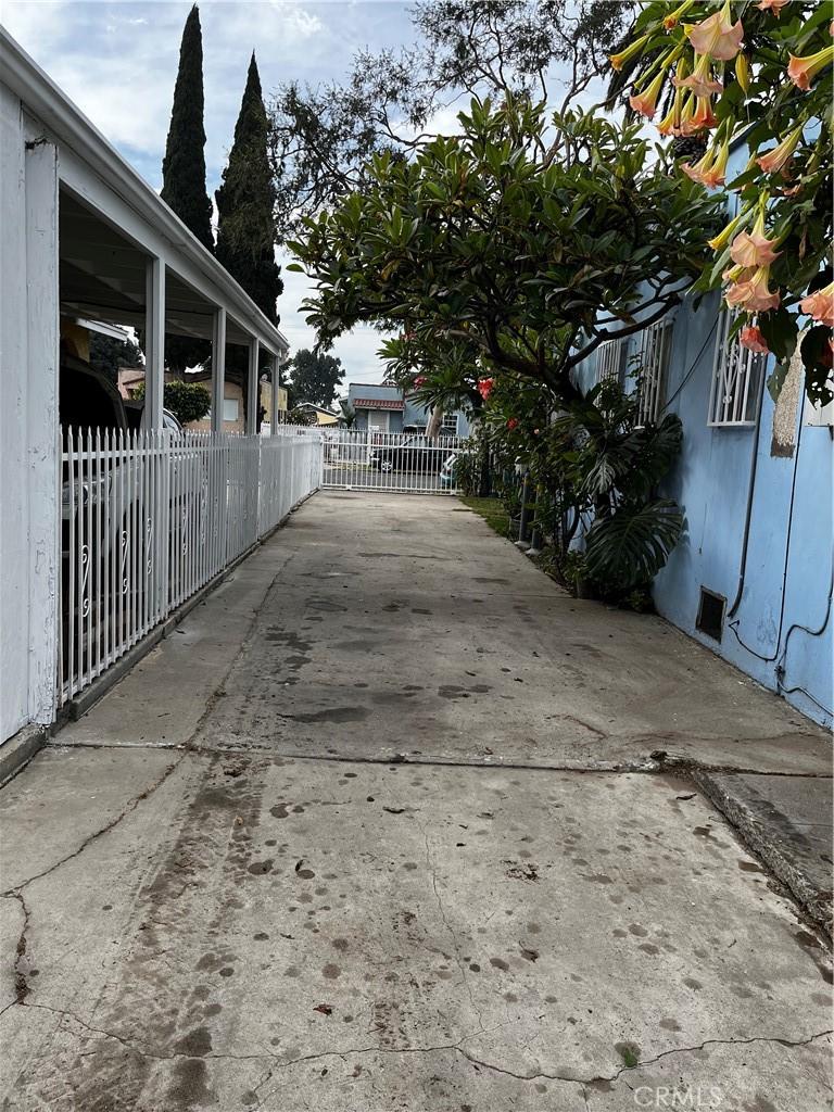 921 E Pine St, Compton, CA 90221 - view of side of property featuring fence and concrete driveway