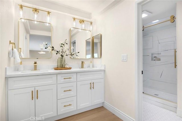 bathroom with vanity, wood-type flooring, and a shower with door