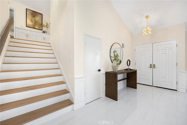 foyer entrance with an inviting chandelier