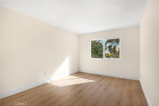 unfurnished room with light hardwood / wood-style floors