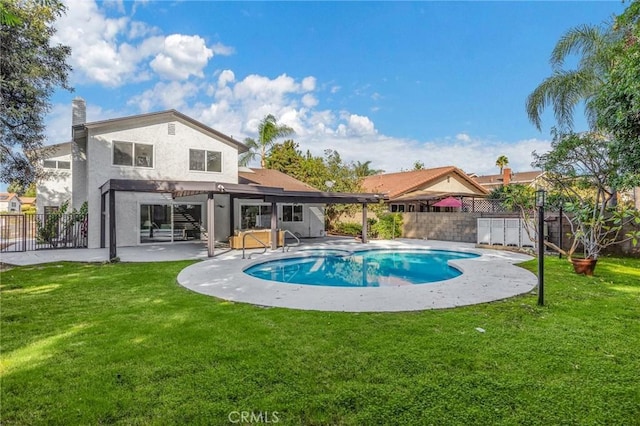 view of swimming pool featuring a patio area and a yard