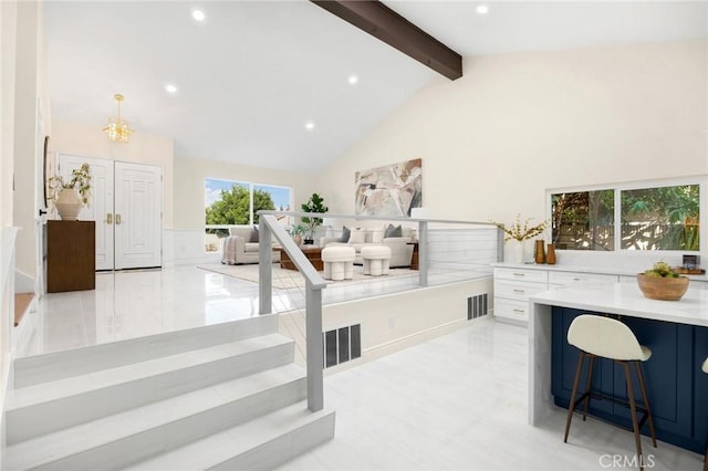 office area featuring beam ceiling, high vaulted ceiling, and an inviting chandelier