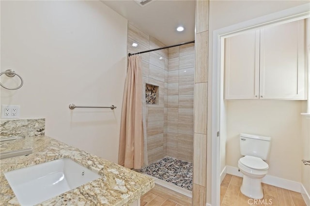 bathroom with a shower with curtain, vanity, toilet, and hardwood / wood-style floors