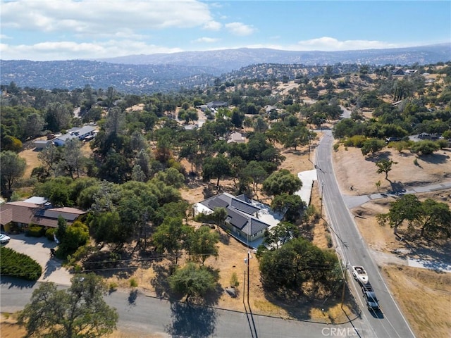 drone / aerial view featuring a mountain view