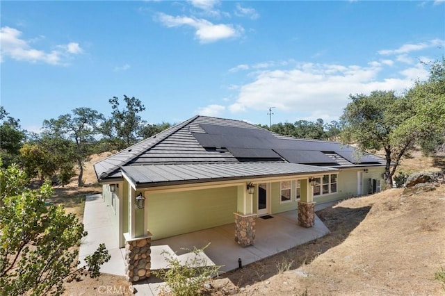 back of property with a patio area