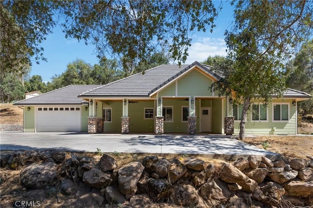 view of front of home with a porch and a garage