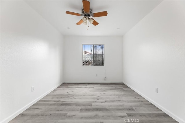 empty room featuring ceiling fan and light wood-type flooring