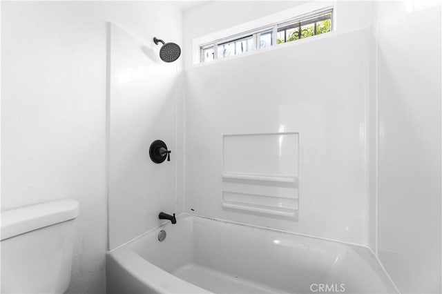 bathroom with shower / bathtub combination and toilet