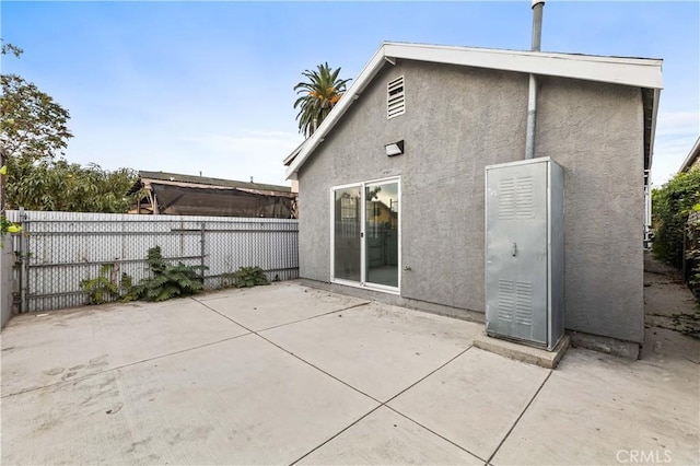 rear view of property featuring a patio