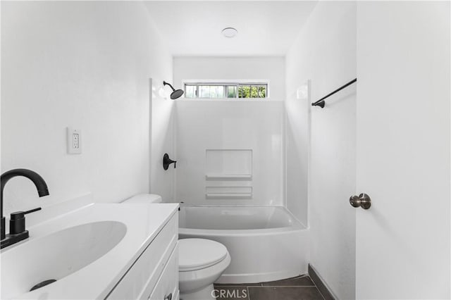 full bathroom with shower / washtub combination, tile patterned flooring, vanity, and toilet