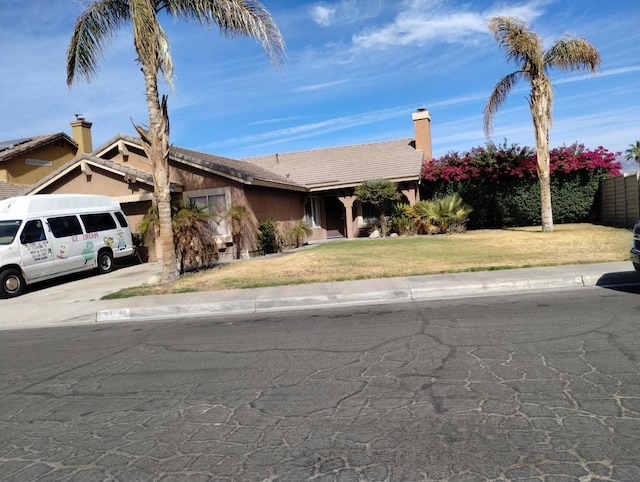 view of front facade featuring a front yard