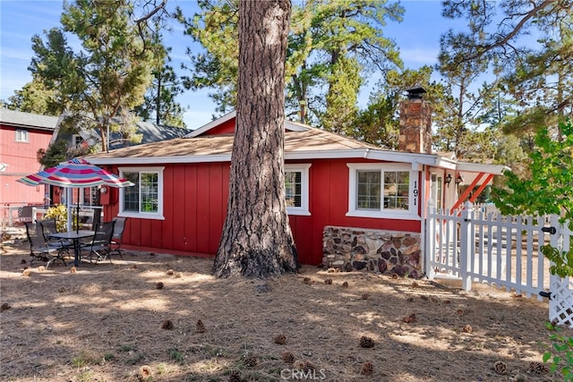 191 Los Angeles Ave, Sugarloaf, CA 92386 - view of front of house with a chimney and board and batten siding