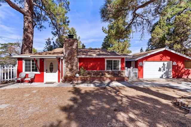 191 Los Angeles Ave, Sugarloaf, CA 92386 - view of front of property featuring driveway, a garage, and a chimney