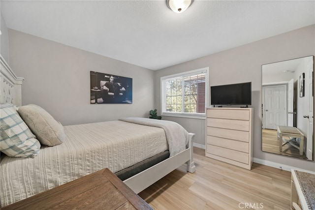 bedroom with light hardwood / wood-style flooring