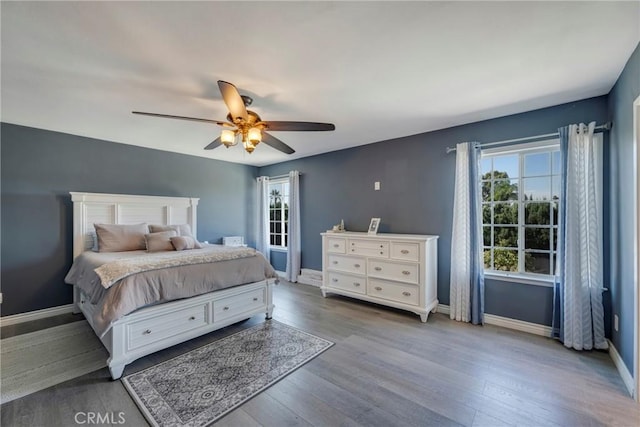 bedroom with hardwood / wood-style flooring and ceiling fan