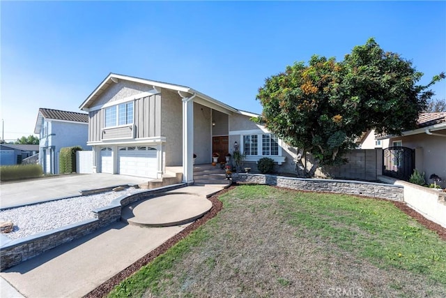 view of front facade with a front yard and a garage